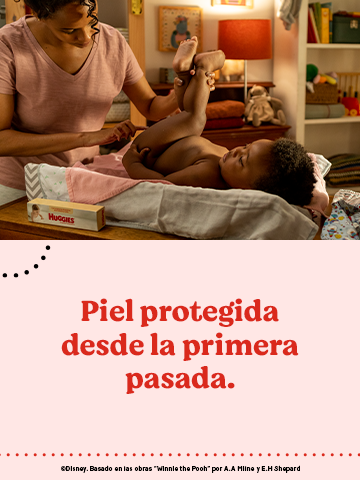 Mãe aplicando pomada protetora em bebê. "Piel protegida desde la primeira pasada."